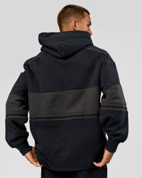 Man wearing A-Team Oversized Hoodie - Caviar-Onyx | Model:Albert | Size:M | Thumbnail Index: 4
