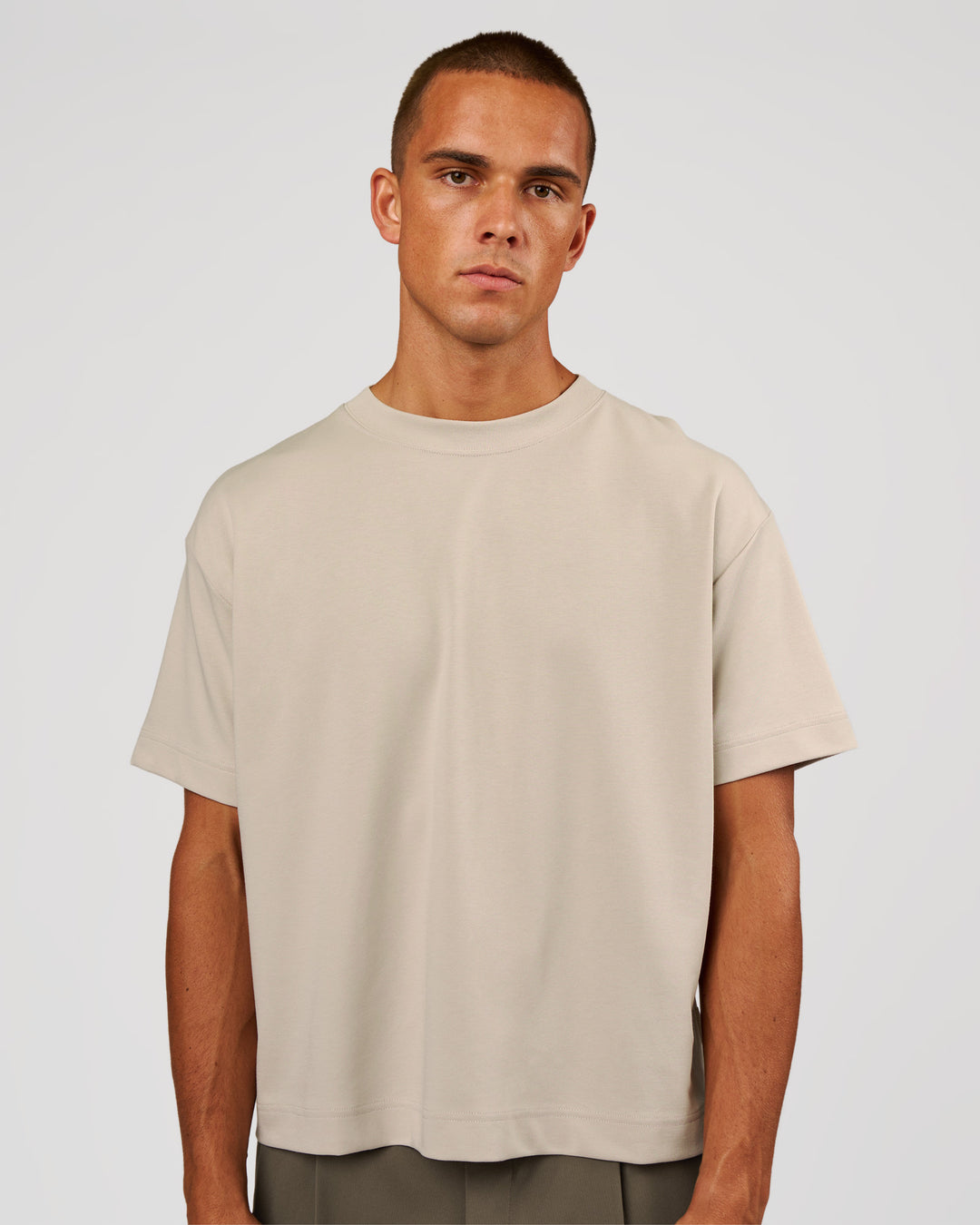 Man wearing AfterDark ZeroCrease Boxy Tee - Shale Beige | Model:Albert | Size:M - view 1