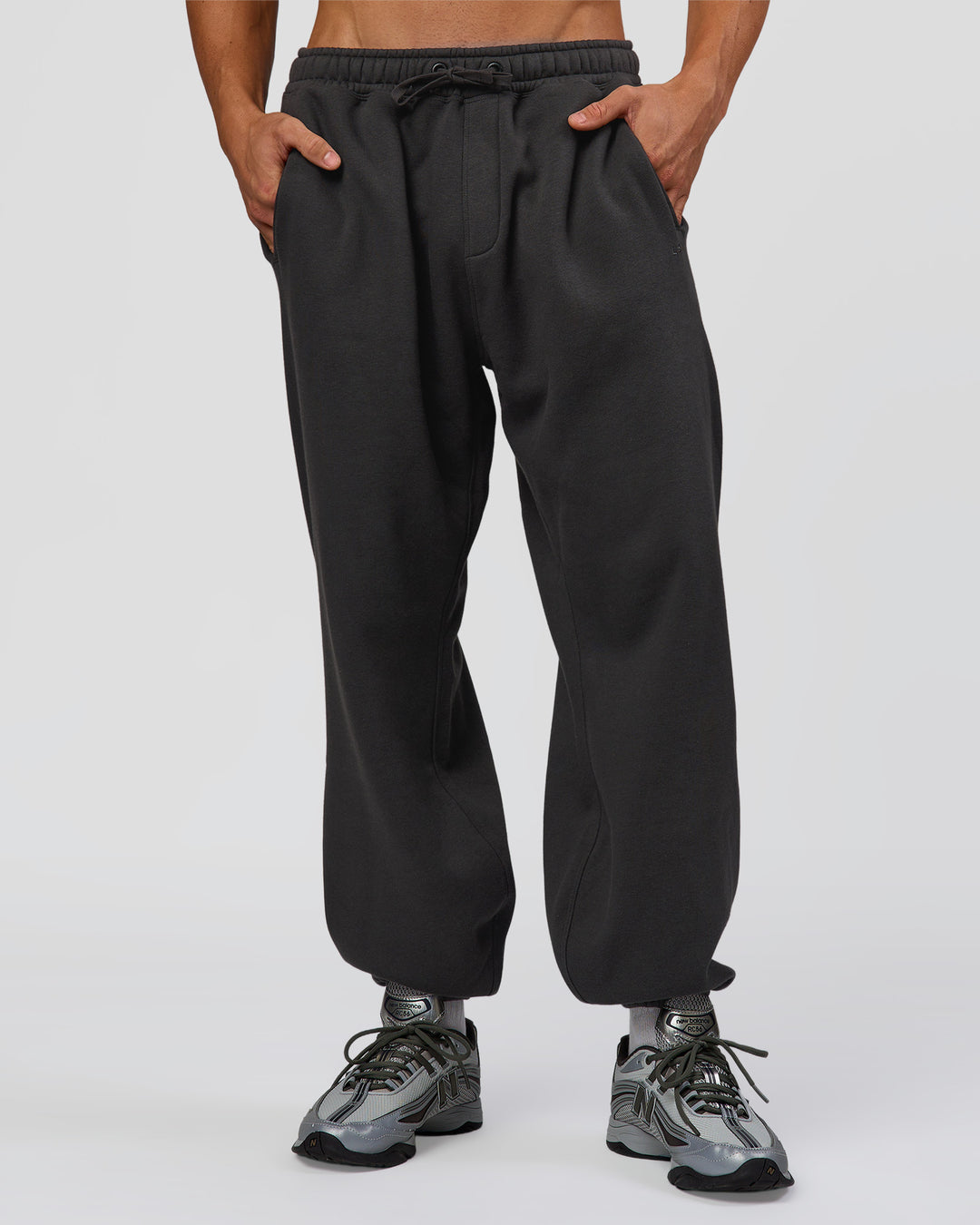 Man wearing Base Baggy Cuffed Track Pant - Onyx | Model:Albert | Size:M - view 2