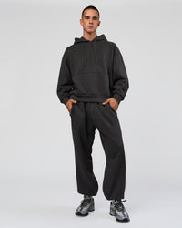 Man wearing Base Baggy Cuffed Track Pant - Onyx | Model:Albert | Size:M | Thumbnail Index: 2