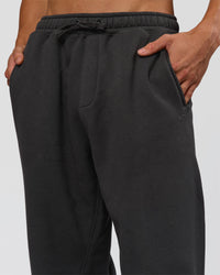 Man wearing Base Baggy Cuffed Track Pant - Onyx | Model:Albert | Size:M | Thumbnail Index: 4