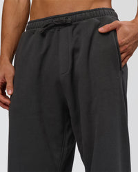 Man wearing Base Baggy Cuffed Track Pant - Onyx | Model:Albert | Size:M | Thumbnail Index: 5
