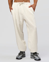 Man wearing Base Baggy Cuffed Track Pant - Silver Marl | Model:Albert | Size:M | Thumbnail Index: 0