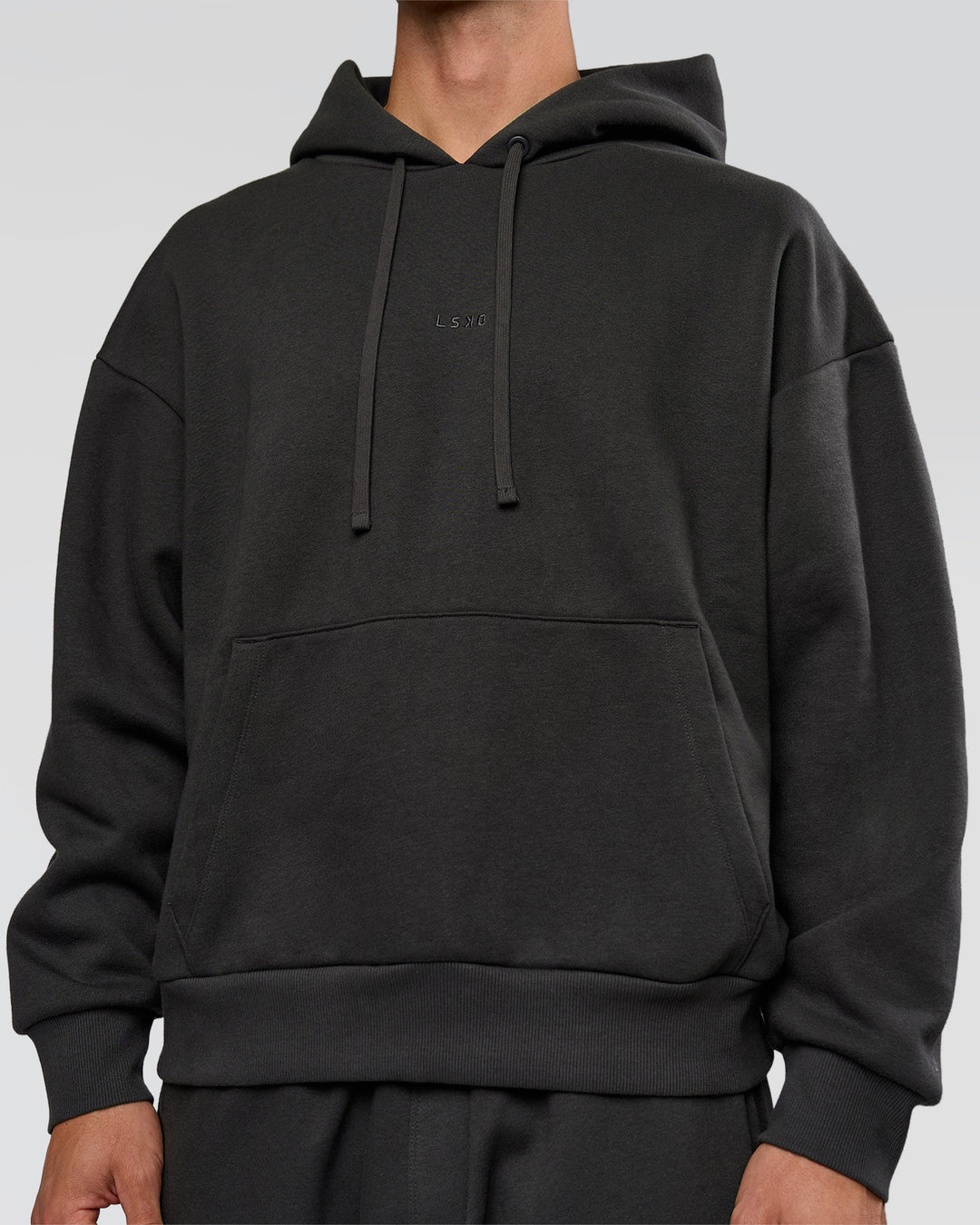 Man wearing Base Oversized DC Hoodie - Onyx | Model:Albert | Size:M - view 8