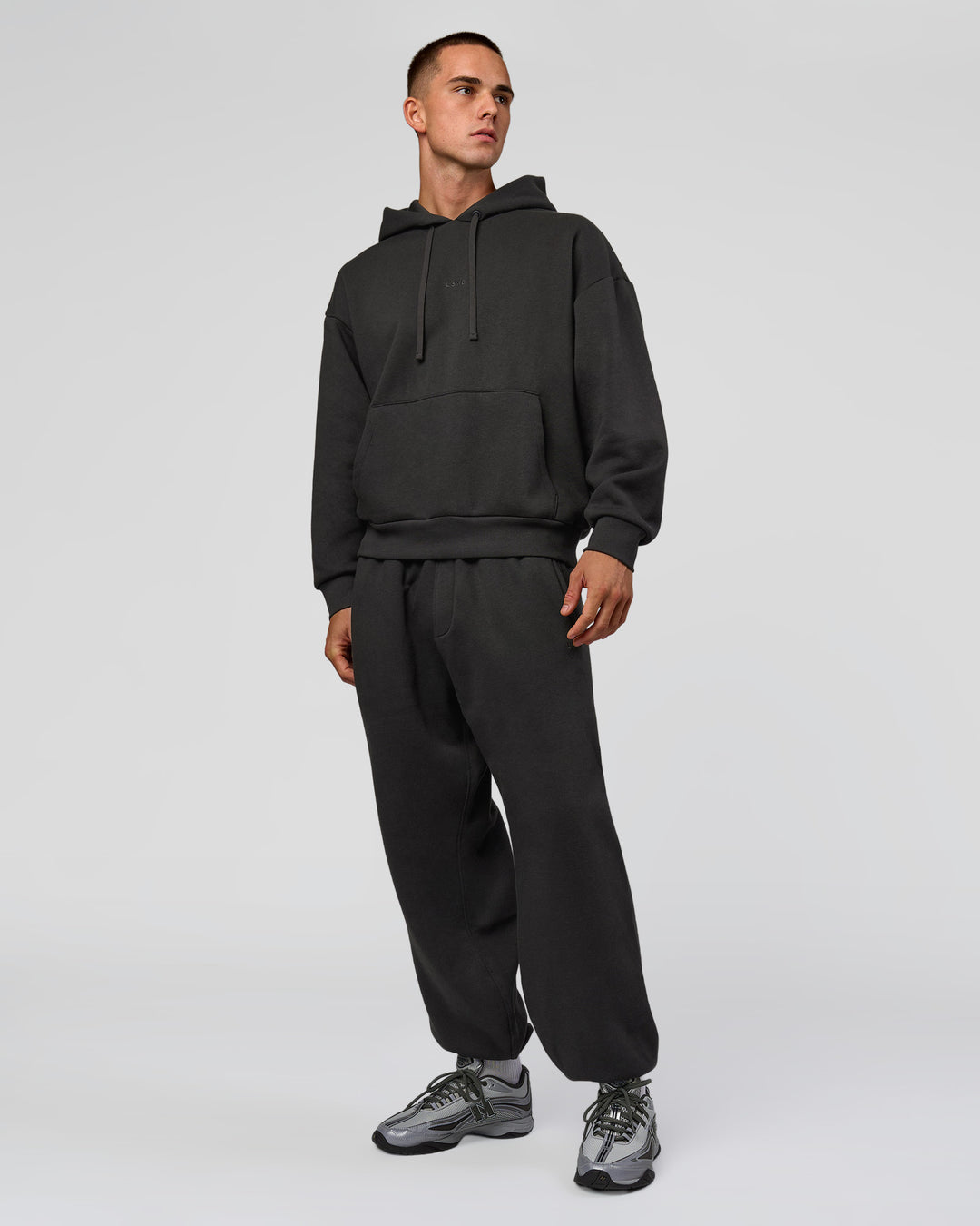 Man wearing Base Oversized DC Hoodie - Onyx | Model:Albert | Size:M - view 12