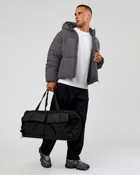 Man wearing Blackout Puffer Jacket - Dark Storm-Black | Model:Albert | Size:M | Thumbnail Index: 14