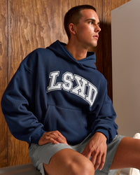 Man wearing Varsity Boxy Hoodie - Future Navy-White | Model:Albert | Size:M | Thumbnail Index: 0