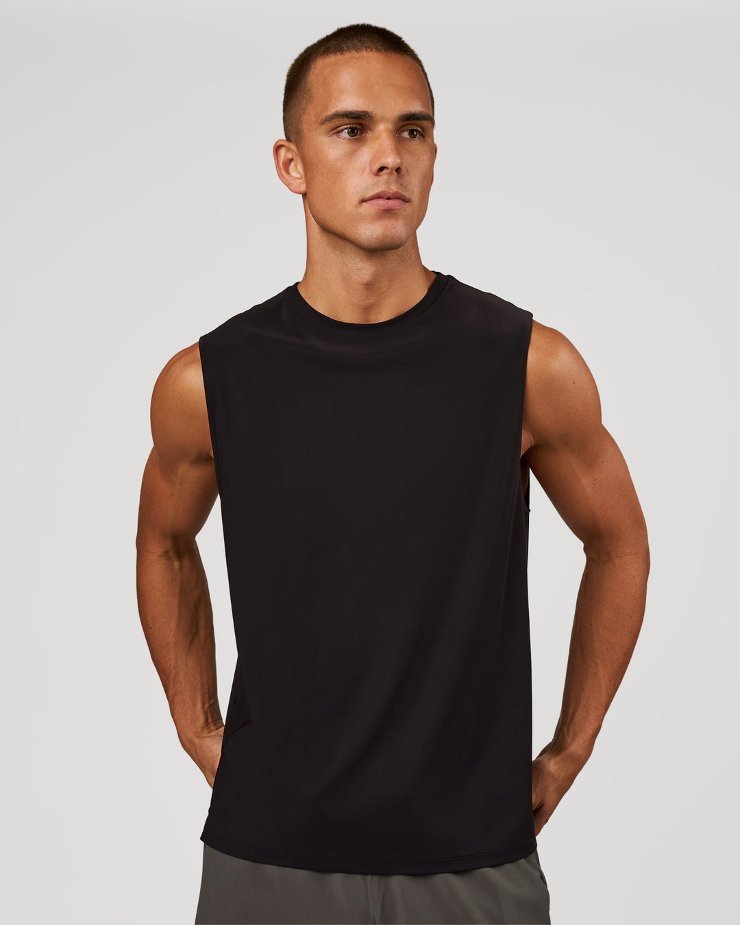 Man wearing Cadence Swift Muscle Tank - Black | Model:Albert | Size:M - view 1