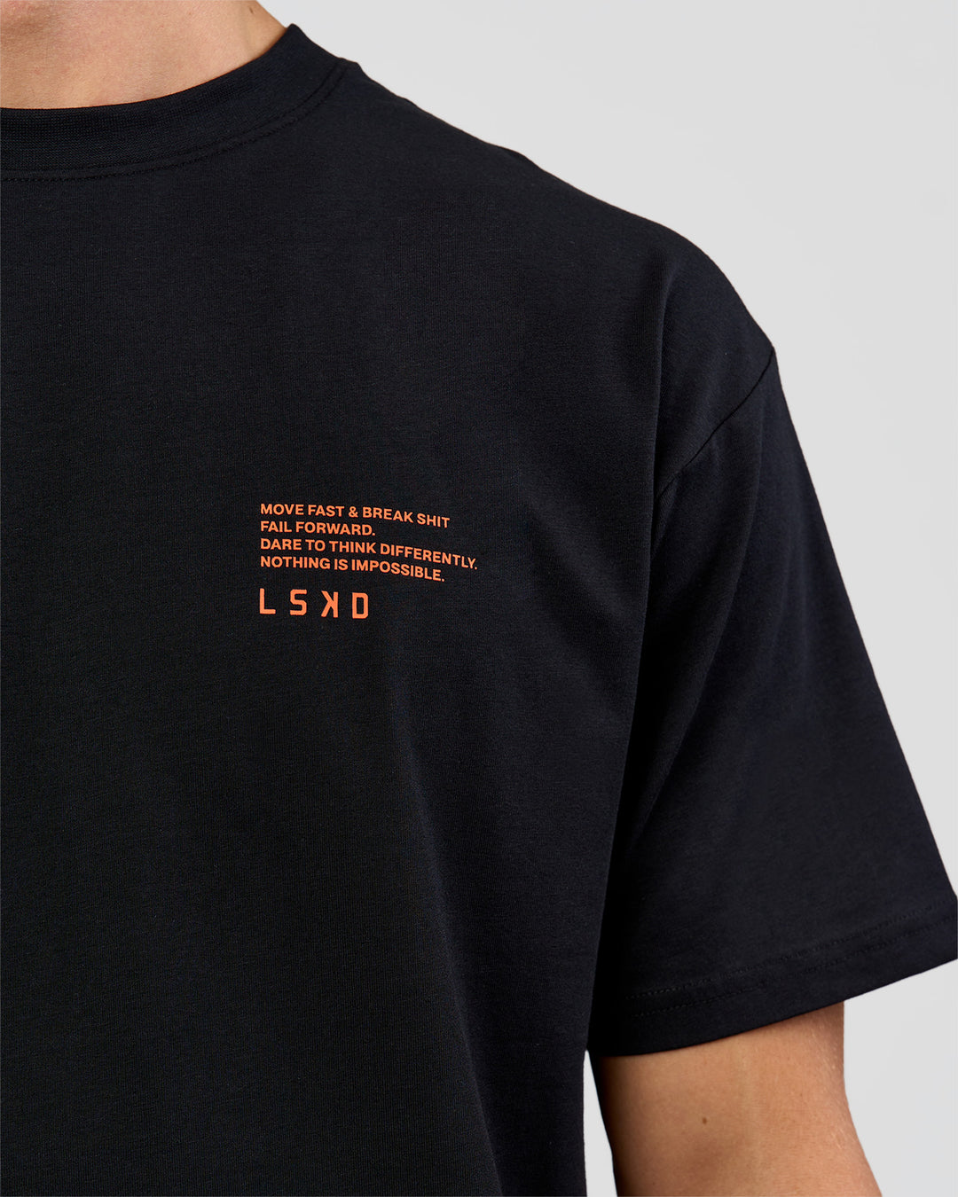 Man wearing Coffee Run FLXCotton Oversized Tee - Black-Ultra Orange | Model:Albert | Size:M - view 23