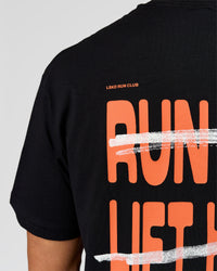 Man wearing Coffee Run FLXCotton Oversized Tee - Black-Ultra Orange | Model:Albert | Size:M | Thumbnail Index: 7