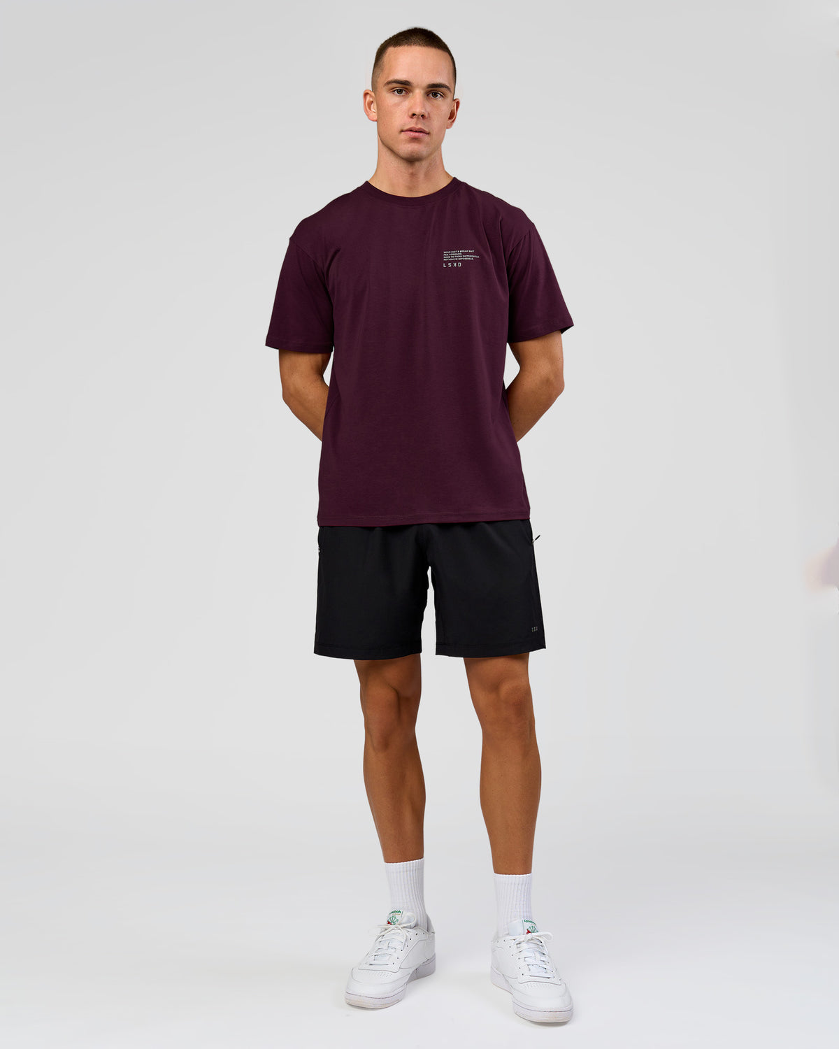 Man wearing Coffee Run FLXCotton Oversized Tee - Cherry Lacquer-Black | Model:Albert | Size:M
