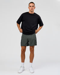 Man wearing Functional Cargo 6" Short - Carbon Green | Model:Albert | Size:M | Thumbnail Index: 1