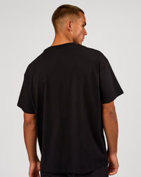 Man wearing Game Plan Heavyweight FLXCotton Oversized Tee - Black | Model:Albert | Size:M | Thumbnail Index: 3