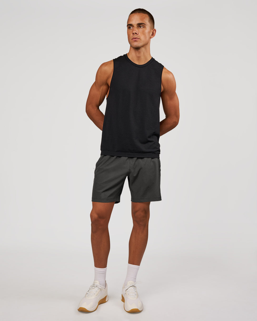 Man wearing AeroFLX+ Seamless Muscle Tank - Black Marl | Model:Albert | Size:M - view 4