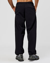 Man wearing Motion Wide Leg Pant - Black | Model:Albert | Size:M | Thumbnail Index: 1