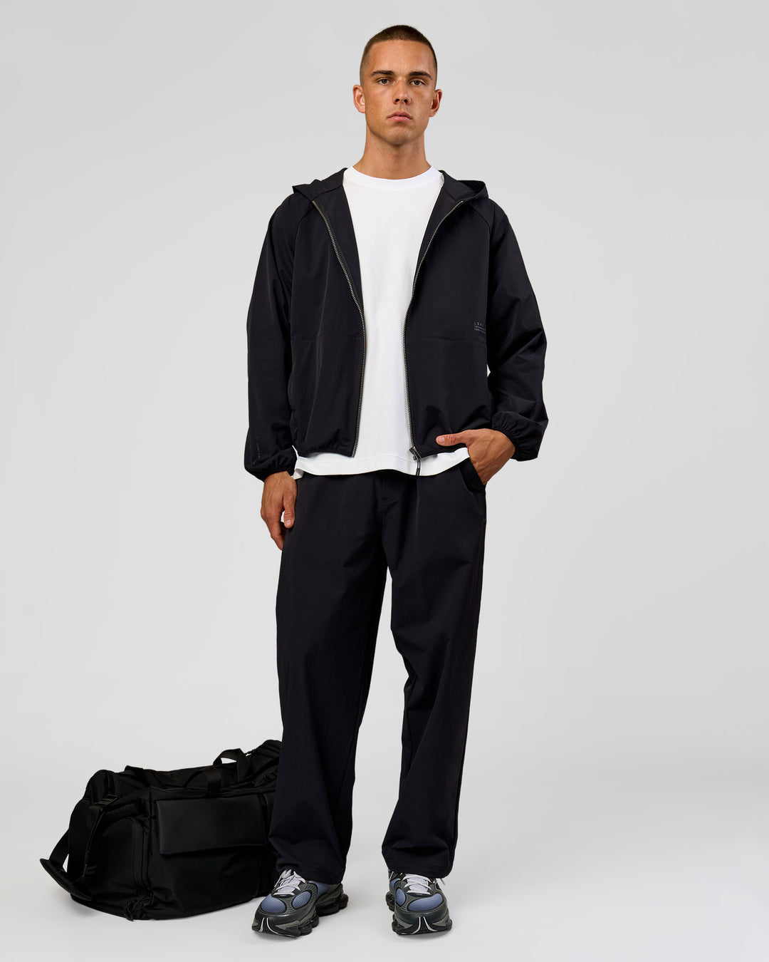 Man wearing Motion Wide Leg Pant - Black | Model:Albert | Size:M - view 3