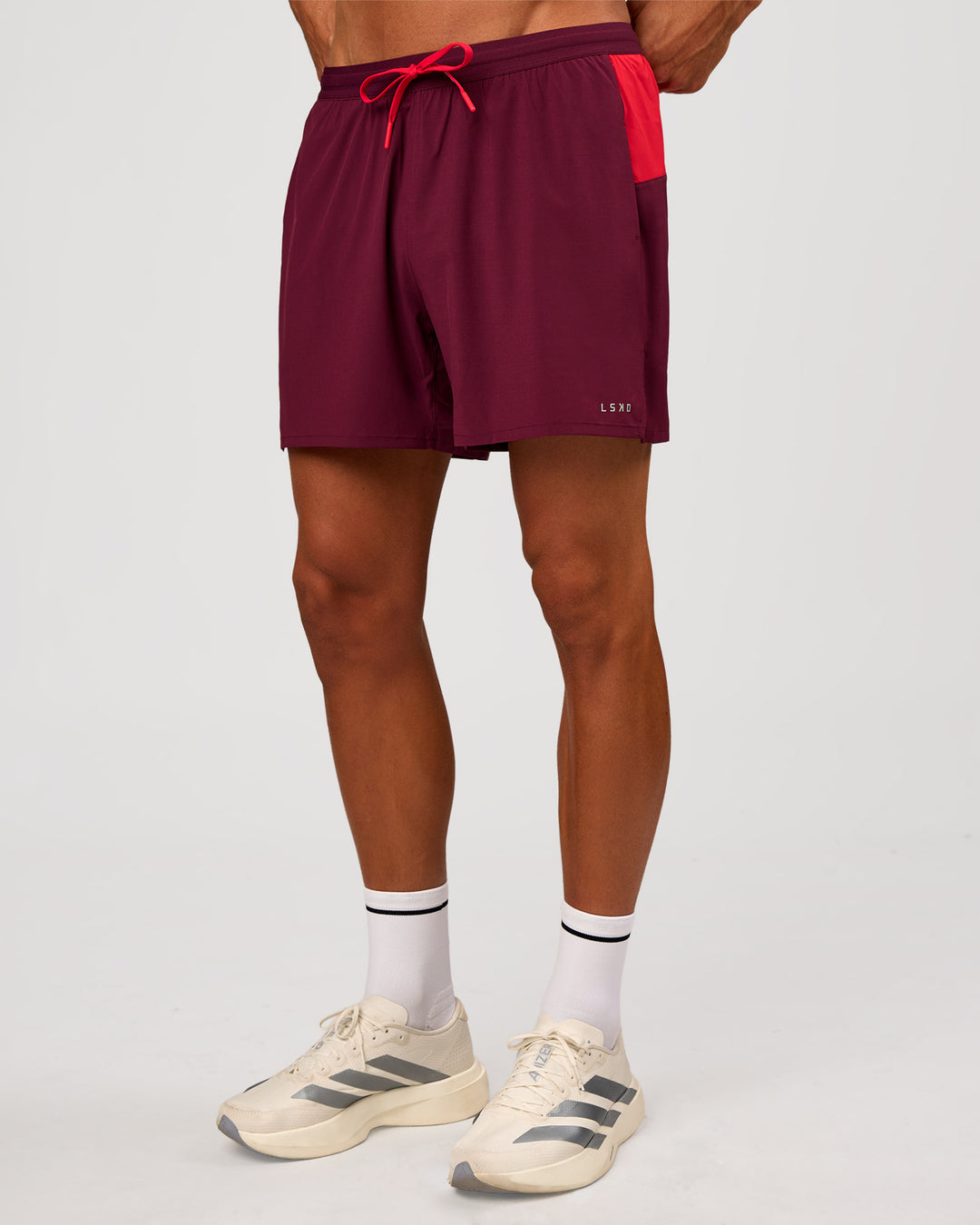 Man wearing Pace 5" Lined Running Short - Cherry Lacquer-Scarlet | Model:Albert | Size:M - view 11