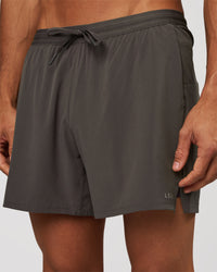 Man wearing Pace 5" Lined Running Short - Dark Storm | Model:Albert | Size:M | Thumbnail Index: 0
