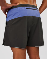Man wearing Pace 5" Lined Running Short - Dark Storm-Bluebell | Model:Albert | Size:M | Thumbnail Index: 1