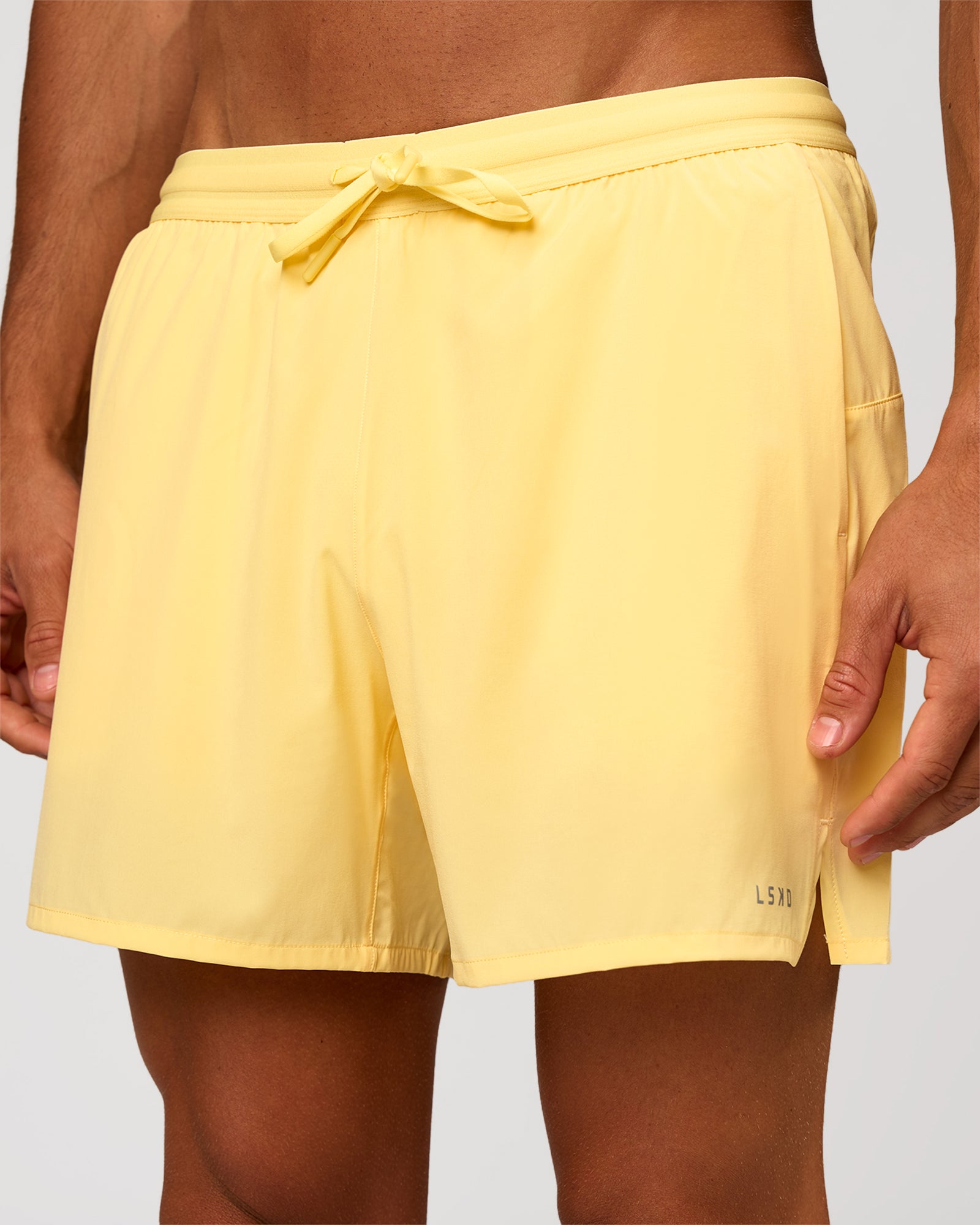 Man wearing Pace 5" Lined Running Short - Lemon | Model:Albert | Size:M