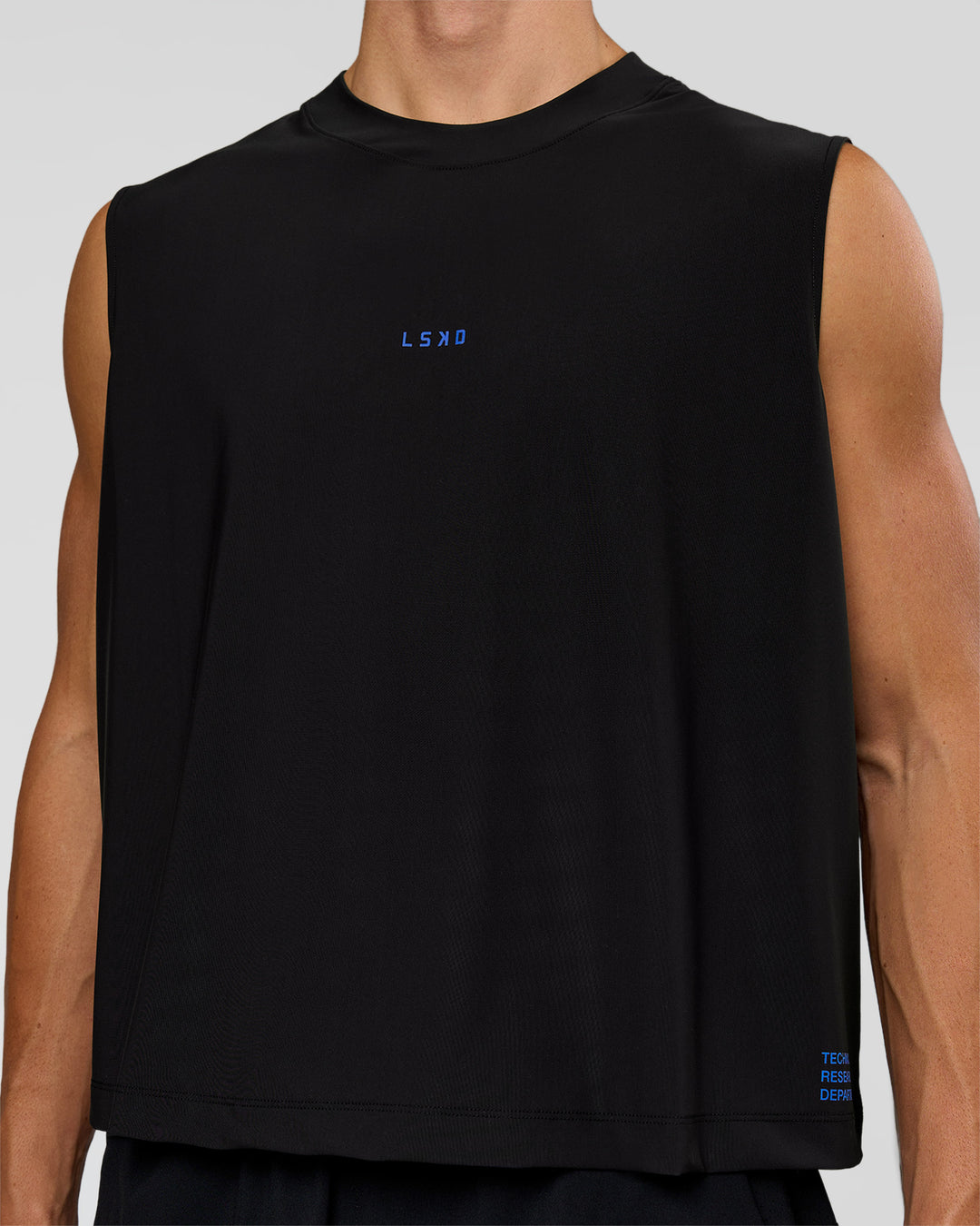 Man wearing Run Club Elevate Muscle Tank - Black-Electric Indigo | Model:Albert | Size:M - view 2