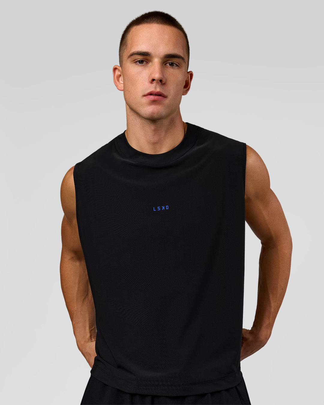 Man wearing Run Club Elevate Muscle Tank - Black-Electric Indigo | Model:Albert | Size:M - view 3
