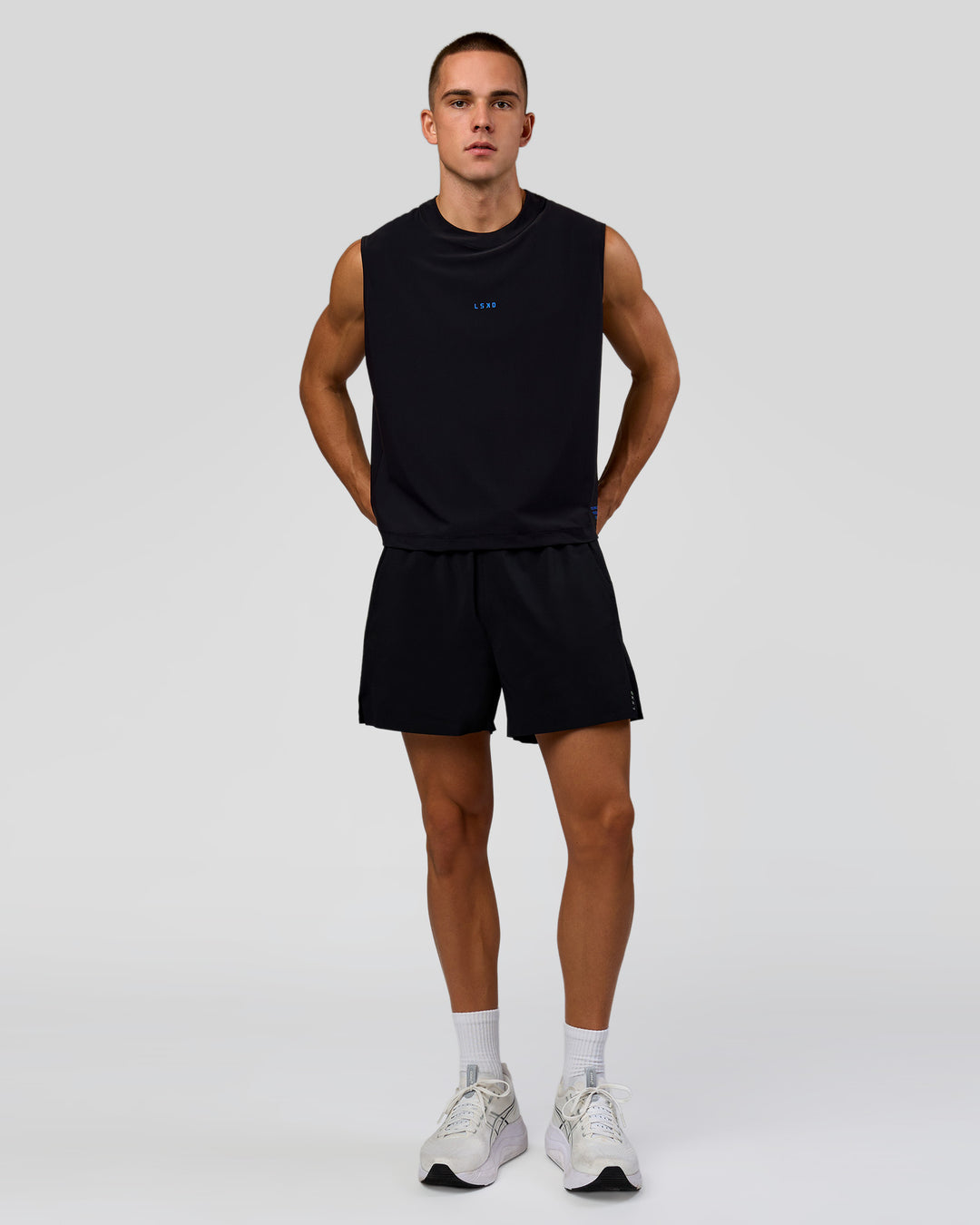 Man wearing Run Club Elevate Muscle Tank - Black-Electric Indigo | Model:Albert | Size:M - view 5