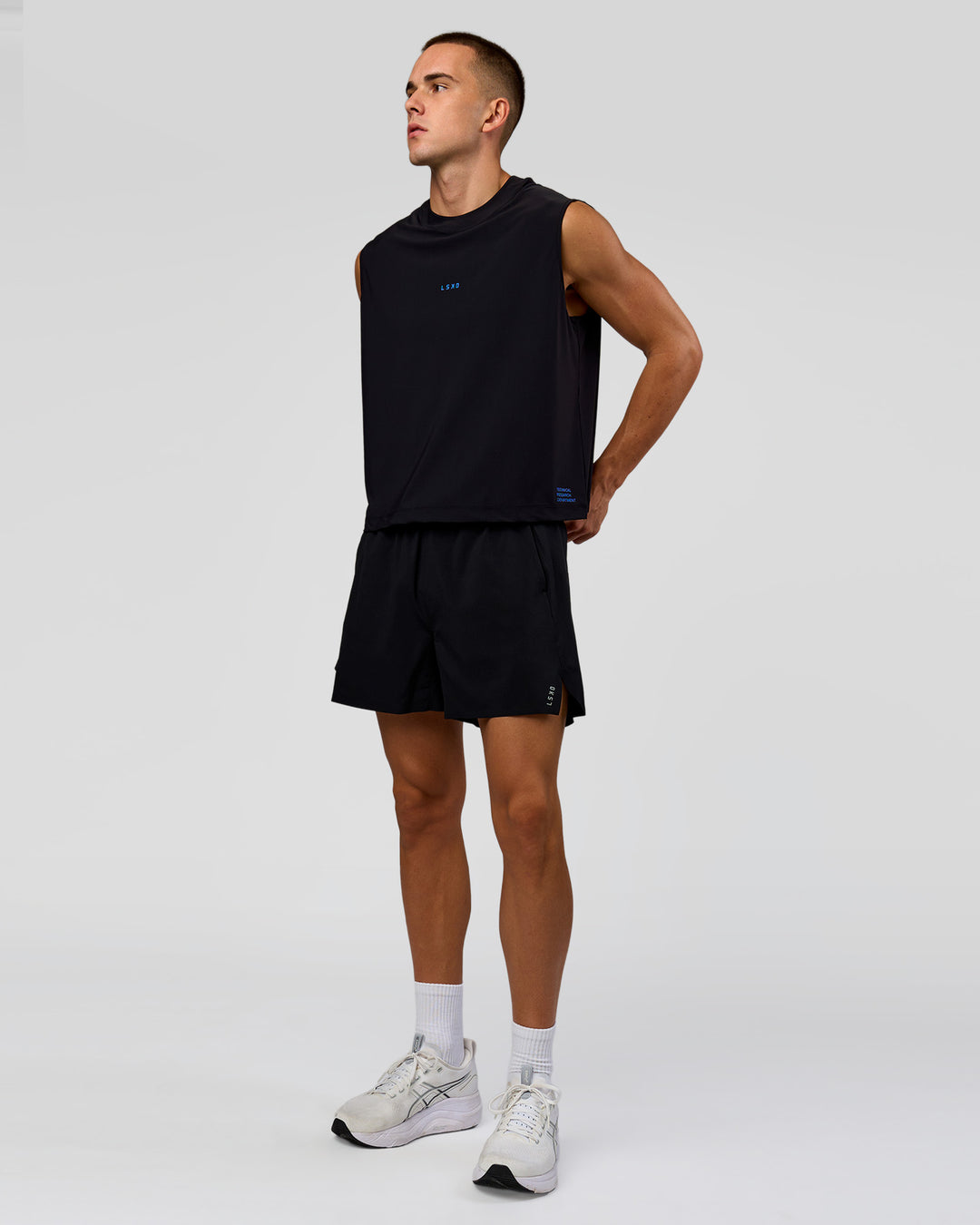 Man wearing Run Club Elevate Muscle Tank - Black-Electric Indigo | Model:Albert | Size:M - view 7