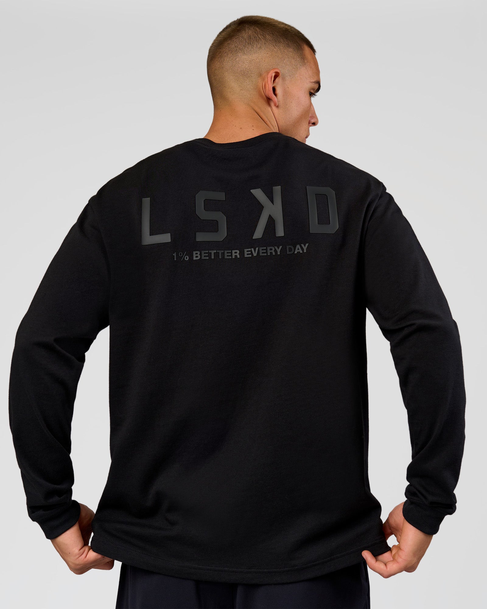 Man wearing Tonal Legacy Heavyweight Oversized LS Tee - Black-Black | Model:Albert | Size:M