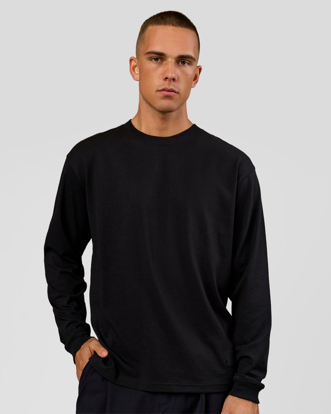 Man wearing Tonal Legacy Heavyweight Oversized LS Tee - Black-Black | Model:Albert | Size:M - view 2