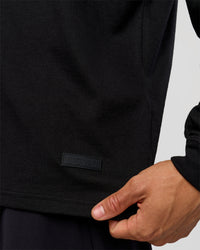 Man wearing Tonal Legacy Heavyweight Oversized LS Tee - Black-Black | Model:Albert | Size:M | Thumbnail Index: 5