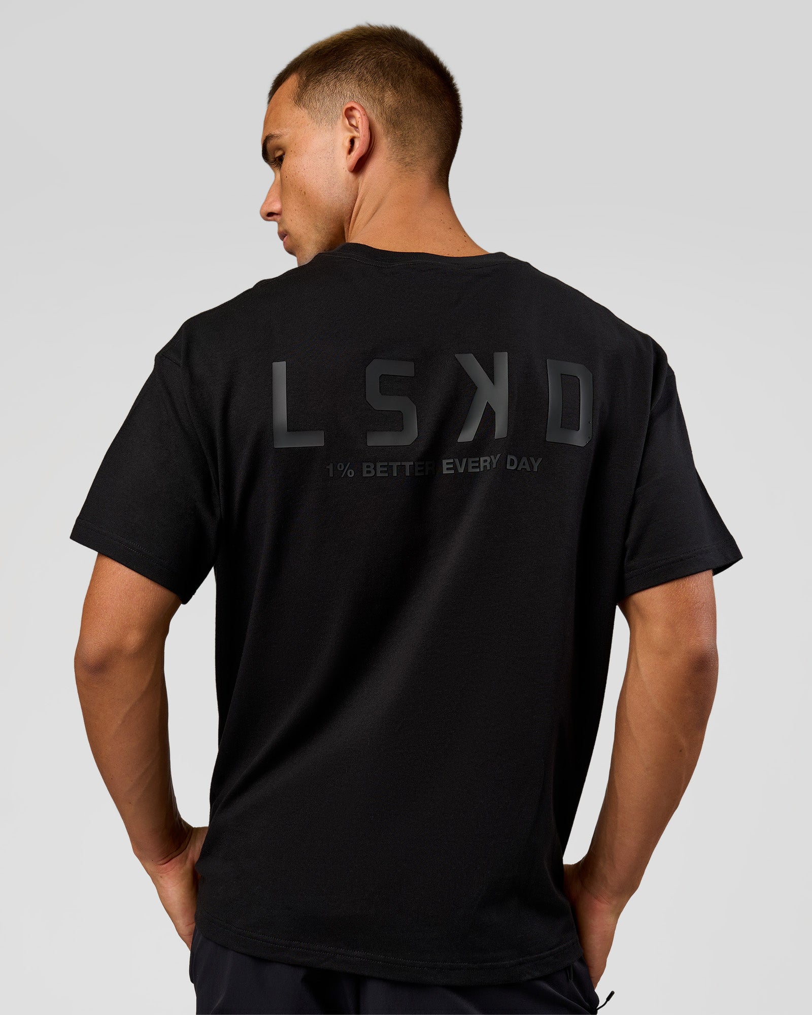 Man wearing Tonal Legacy Heavyweight Oversized Tee - Black-Black | Model:Albert | Size:M