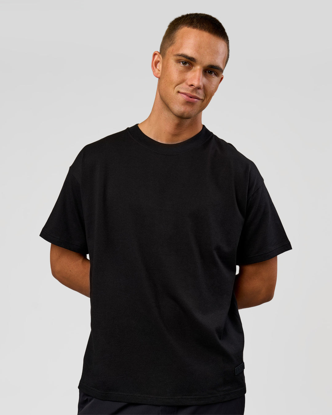 Man wearing Tonal Legacy Heavyweight Oversized Tee - Black-Black | Model:Albert | Size:M - view 8