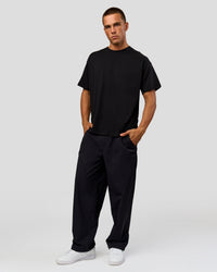 Man wearing Tonal Legacy Heavyweight Oversized Tee - Black-Black | Model:Albert | Size:M | Thumbnail Index: 13