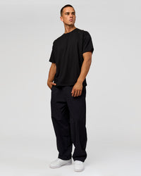 Man wearing Tonal Legacy Heavyweight Oversized Tee - Black-Black | Model:Albert | Size:M | Thumbnail Index: 15