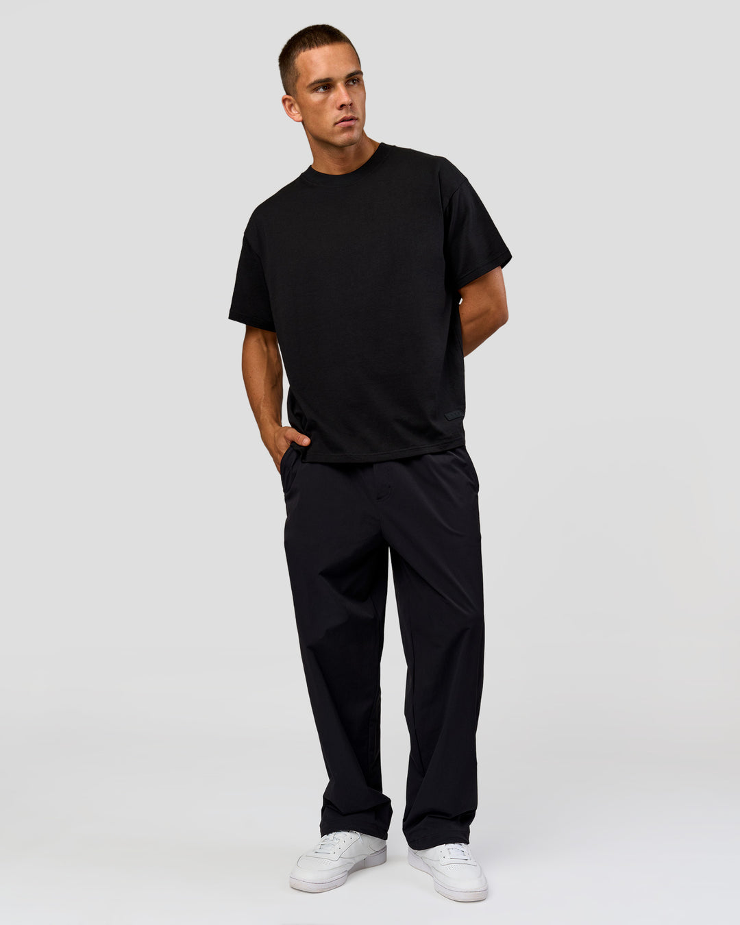 Man wearing Tonal Legacy Heavyweight Oversized Tee - Black-Black | Model:Albert | Size:M - view 17