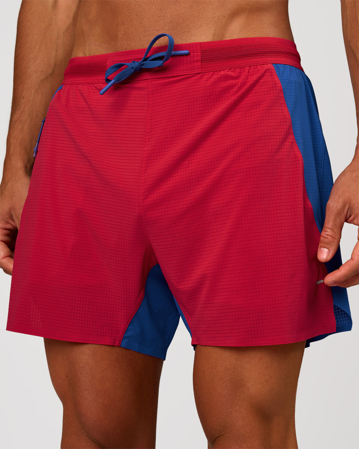 Man wearing UltraAir 5" Lined Performance Short - Scarlet-Electric Indigo | Model: Albert | Size: M