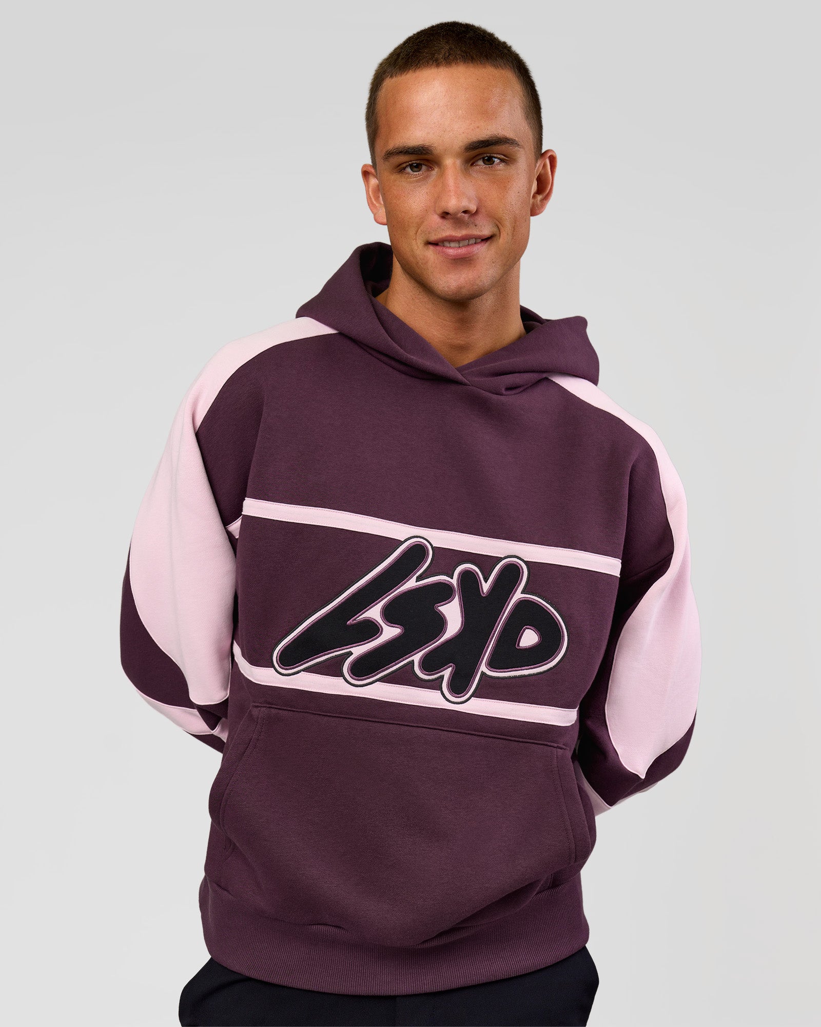 Man wearing Vibe Oversized Hoodie - Midnight Plum-Marshmallow | Model:Albert | Size:M