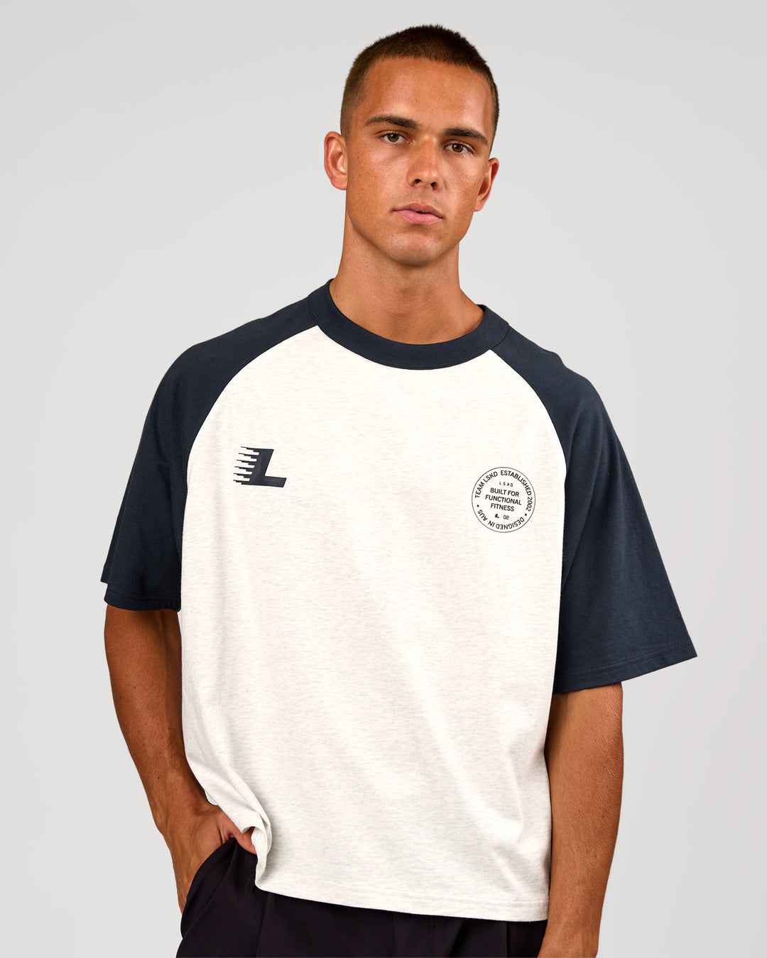 Man wearing Victory Heavyweight Boxed Raglan Tee - Silver Marl-Midnight Navy | Model:Albert | Size:M - view 2