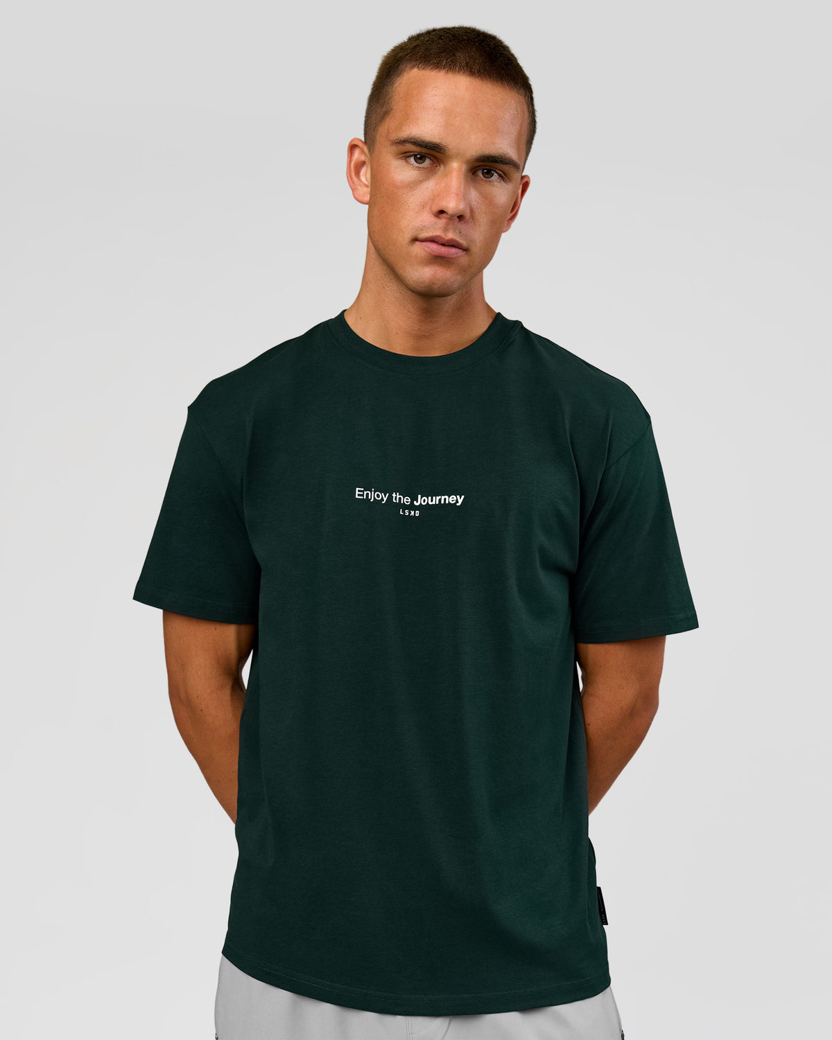 Man wearing VS1 Enjoy The Journey FLXCotton Oversize Tee - Midnight Green | Model:Albert | Size:M