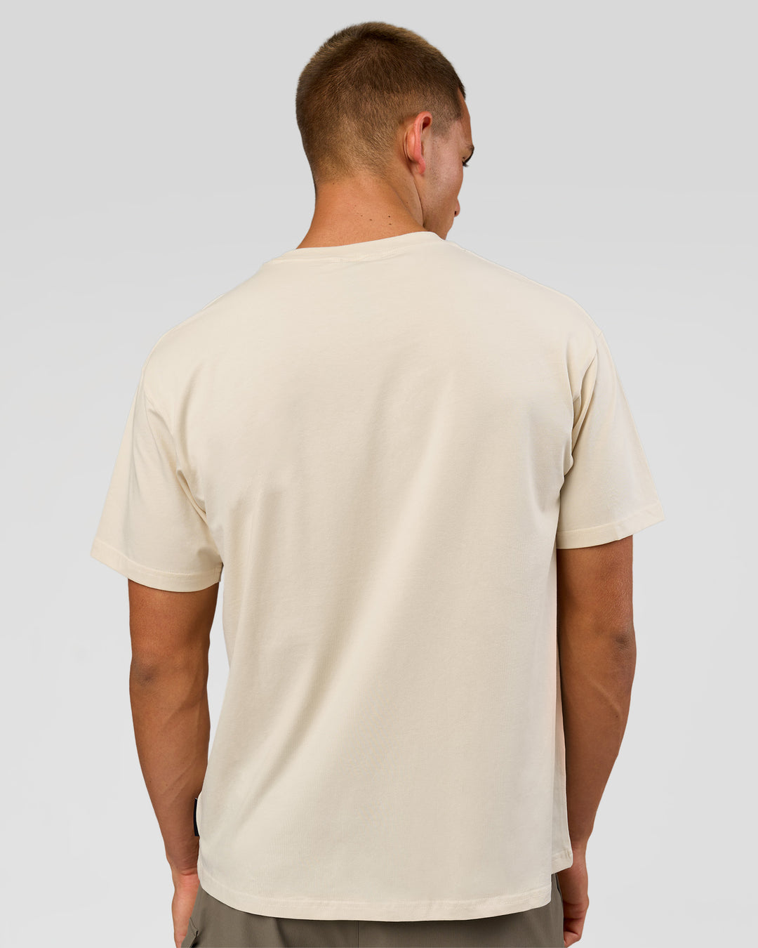 Man wearing VS1 Enjoy The Journey FLXCotton Oversize Tee - Vanilla Bean | Model:Albert | Size:M - view 7