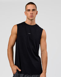 Man wearing Base FLXCotton Tank - Black | Model:Base | Size:M | Thumbnail Index: 2
