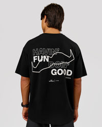 Man wearing Movember x LSKD FLXCotton Oversize Tee - Black-White | Model:George | Size:M | Thumbnail Index: 0