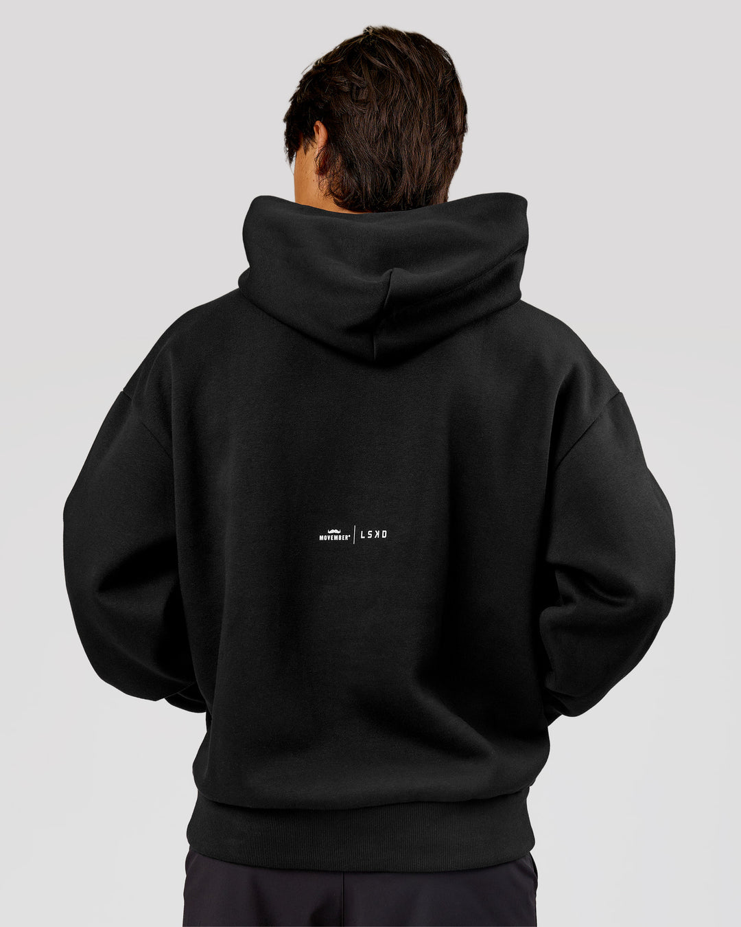Man wearing Movember x LSKD Oversized Hoodie - Black | Model:George | Size:M - view 4