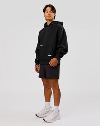 Man wearing Movember x LSKD Oversized Hoodie - Black | Model:George | Size:M | Thumbnail Index: 6
