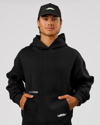 Man wearing Movember x LSKD Oversized Hoodie - Black | Model:George | Size:M | Thumbnail Index: 14