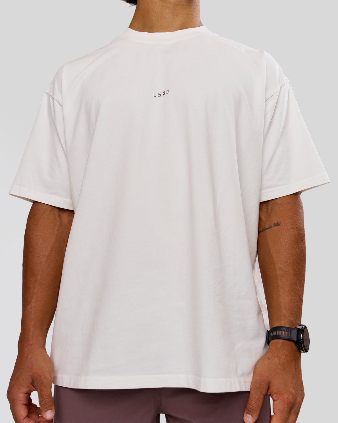 Man wearing Run Club Unisex Oversized Heavyweight FLXCotton Tee - Off White | Model:George | Size:M - view 3