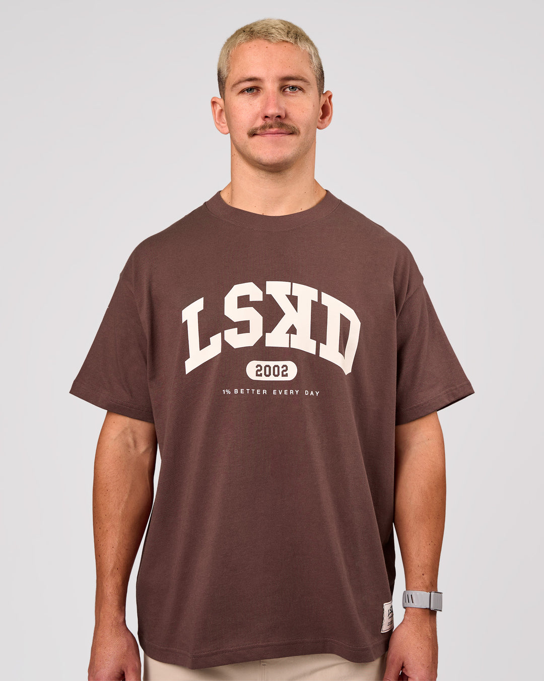 Man wearing Varsity EST Heavyweight Oversized Tee  - Cocoa Powder-Off White | Model:Jaiden | Size:M - view 2