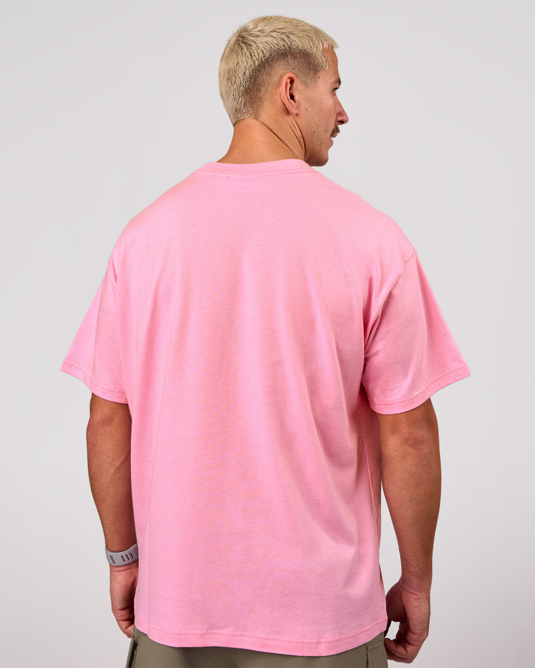 Man wearing Varsity EST Heavyweight Oversized Tee  - Pink Rose-Future Navy | Model:Jaiden | Size:M - view 9