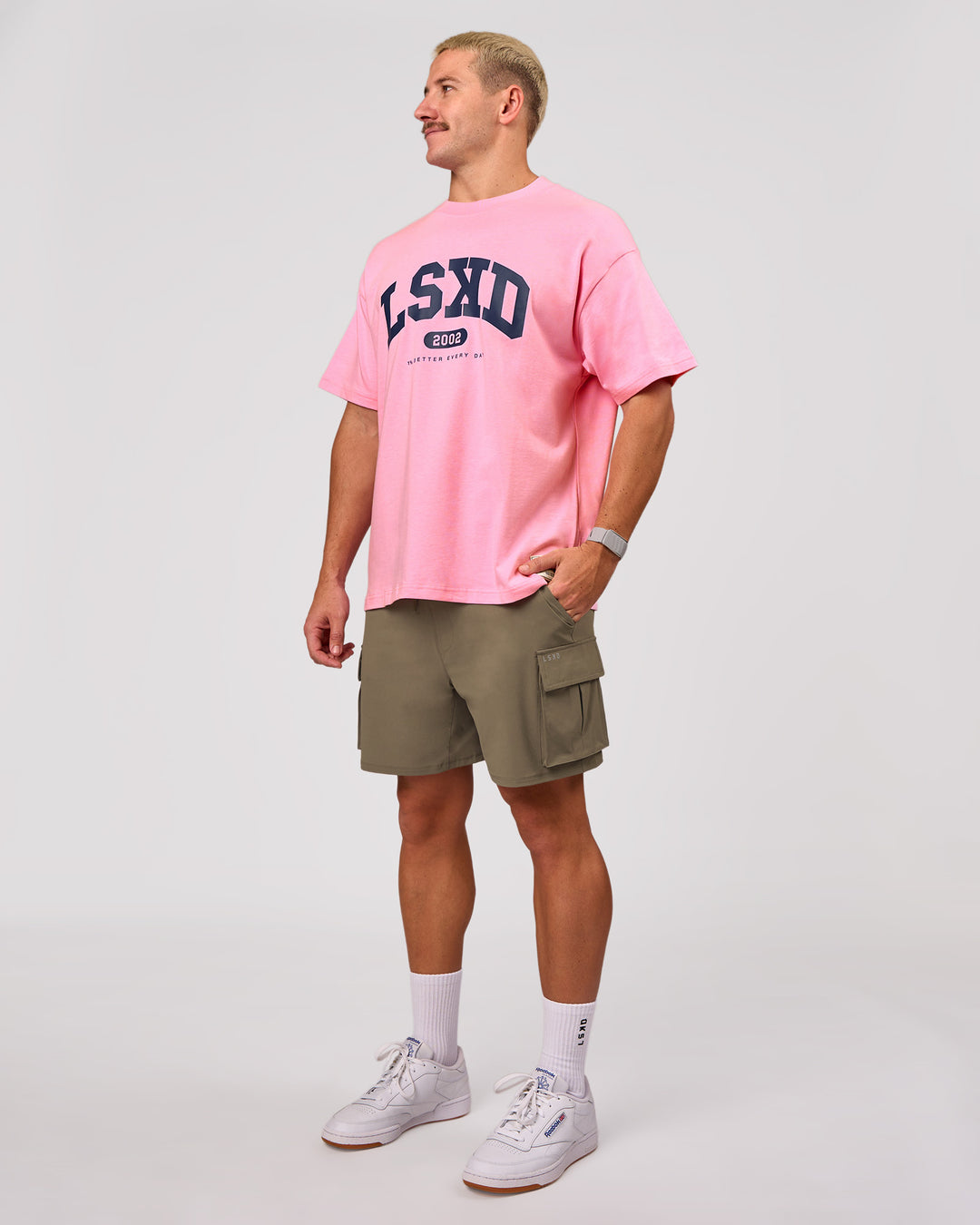 Man wearing Varsity EST Heavyweight Oversized Tee  - Pink Rose-Future Navy | Model:Jaiden | Size:M - view 11